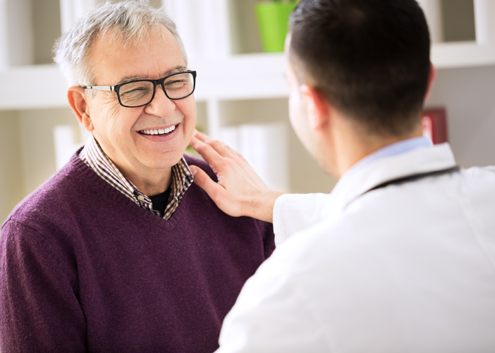 smiling patient with physician