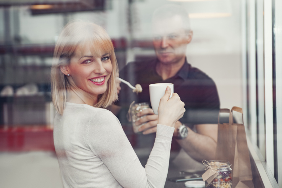 Woman smiling through a window 