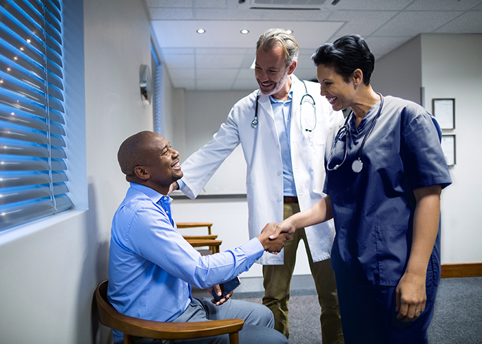 Physicians meet with patient