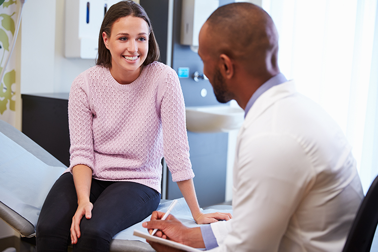 Physician meets with patient