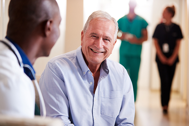 Older man and physician have a chat