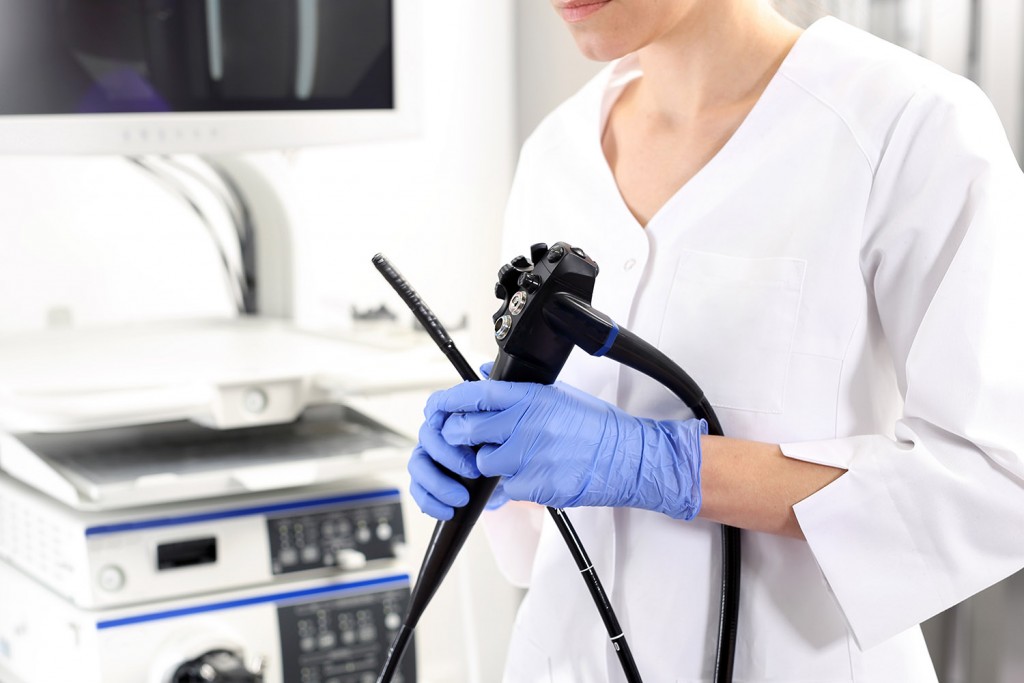 Physician holding an endoscope
