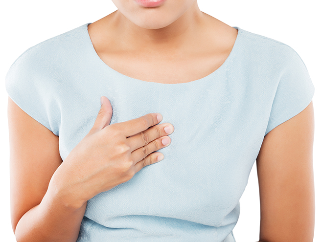 Woman suffering from heartburn