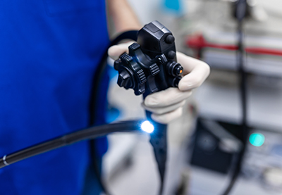 Doctor Holding Colonoscope