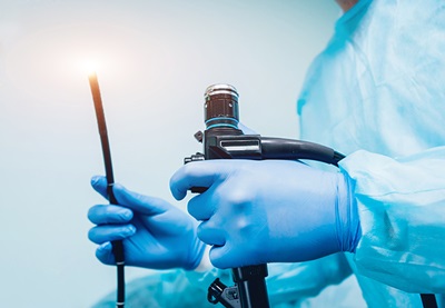 Doctor Holding Colonoscope